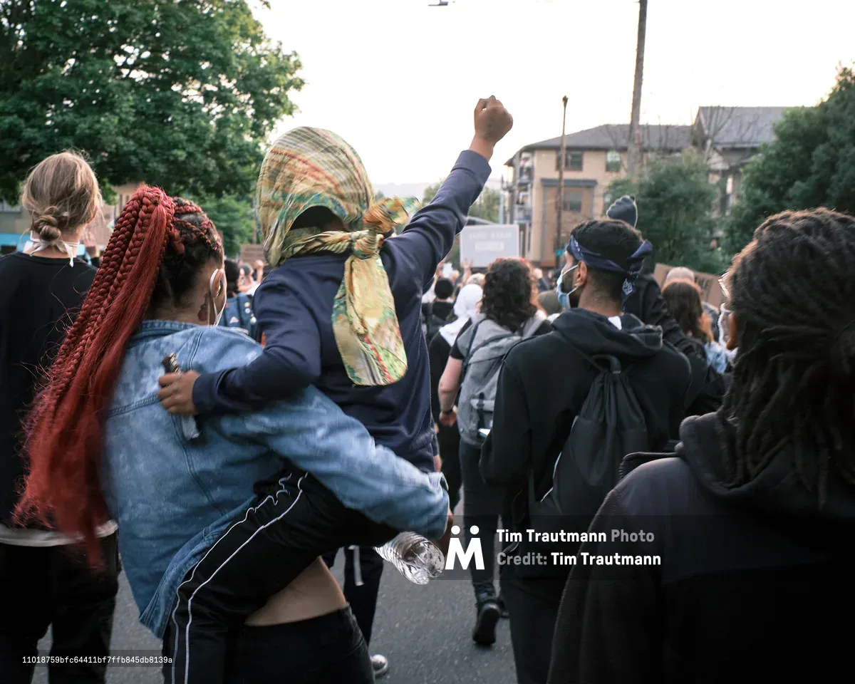 A child raises a fist during a Black Lives Matter march in Portland, Oregon, May 31, 2020.