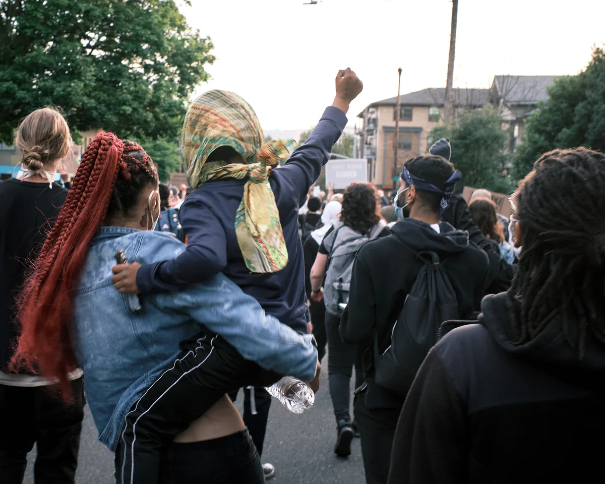 A child raises a fist during a Black Lives Matter march in Portland, Oregon, May 31, 2020.