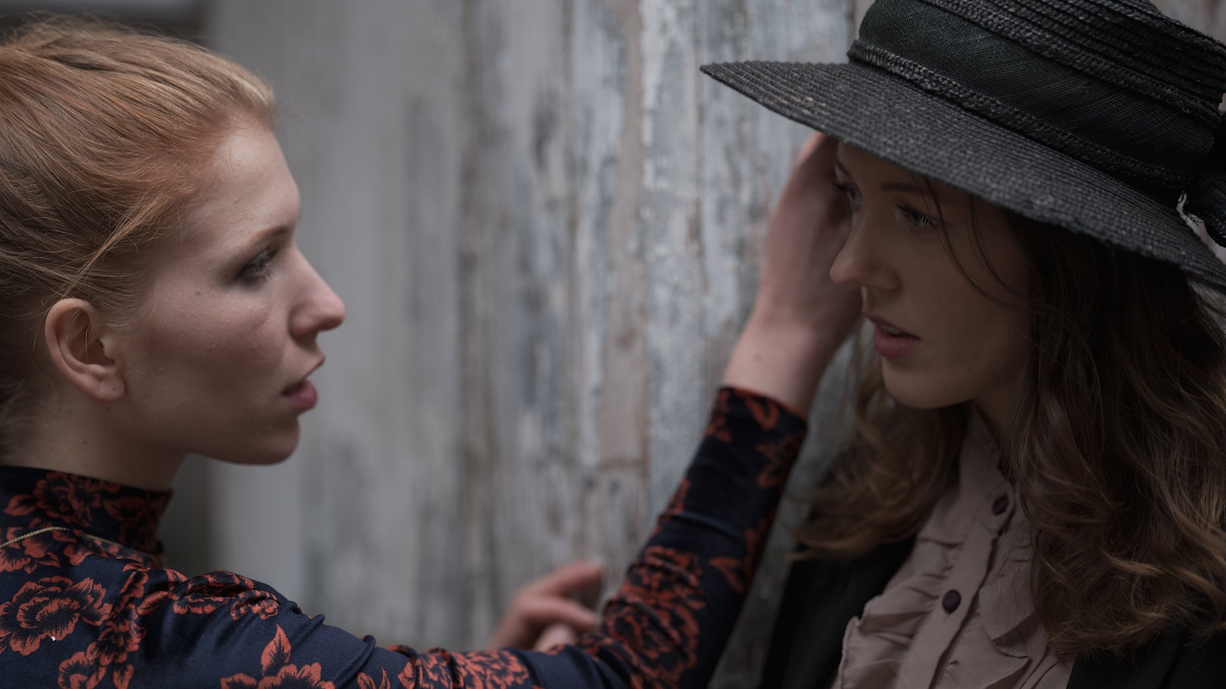 Two women intently looking at eachother.