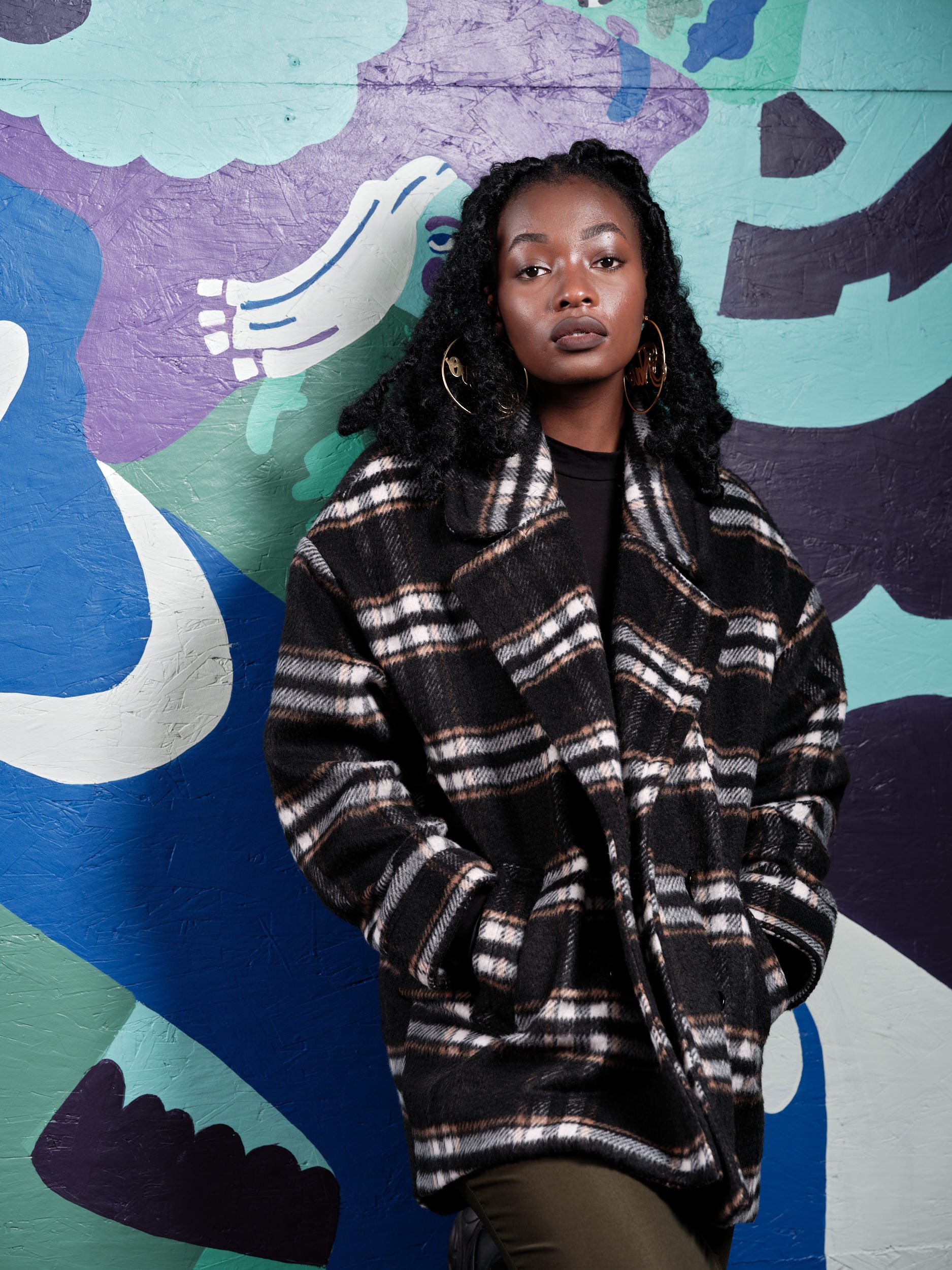 An artist portrait of graphic designer and illustrator Naomi Likayi