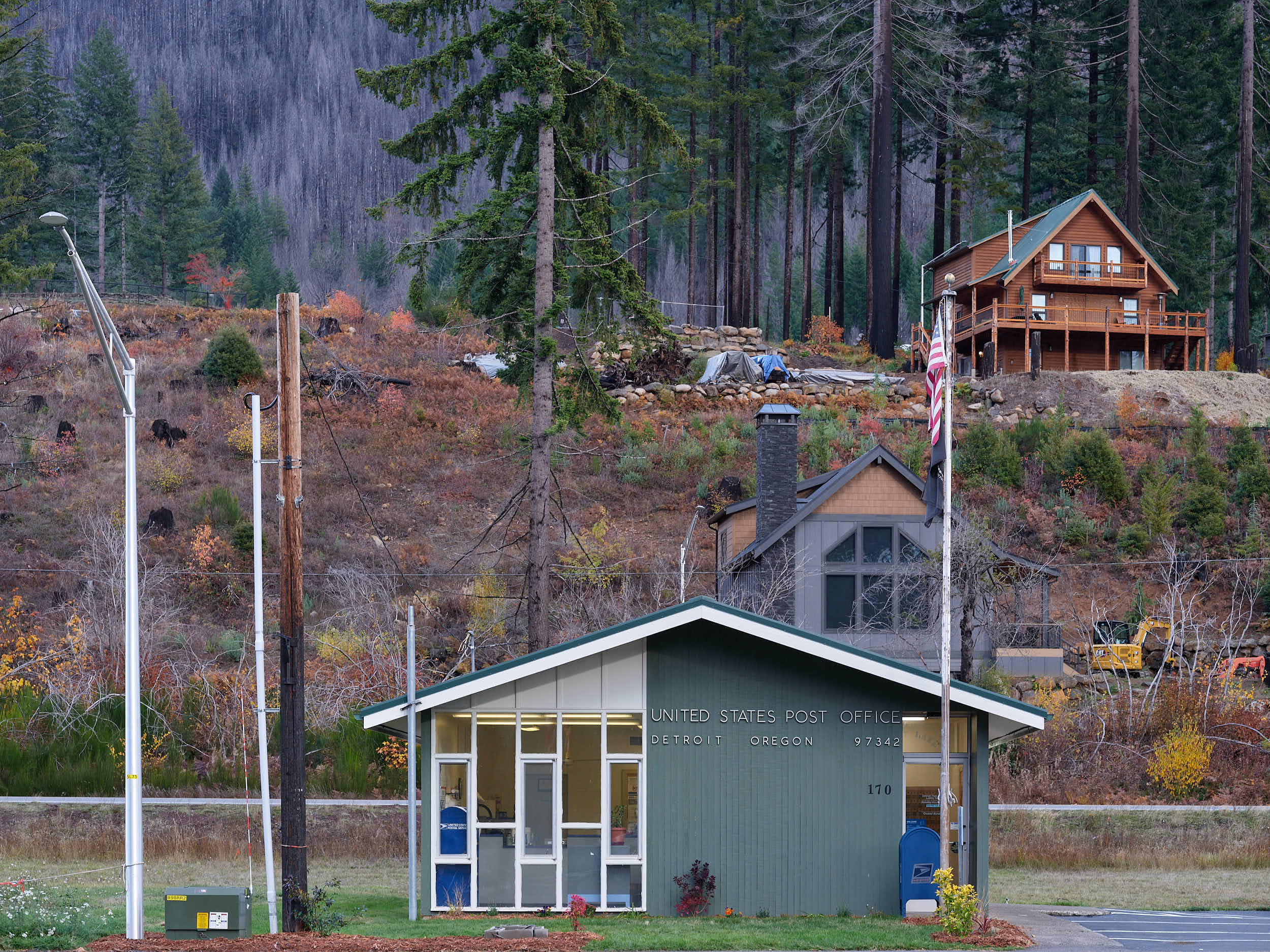 The post office in Detroit, Oregon surrounded by severe wildfire damage.